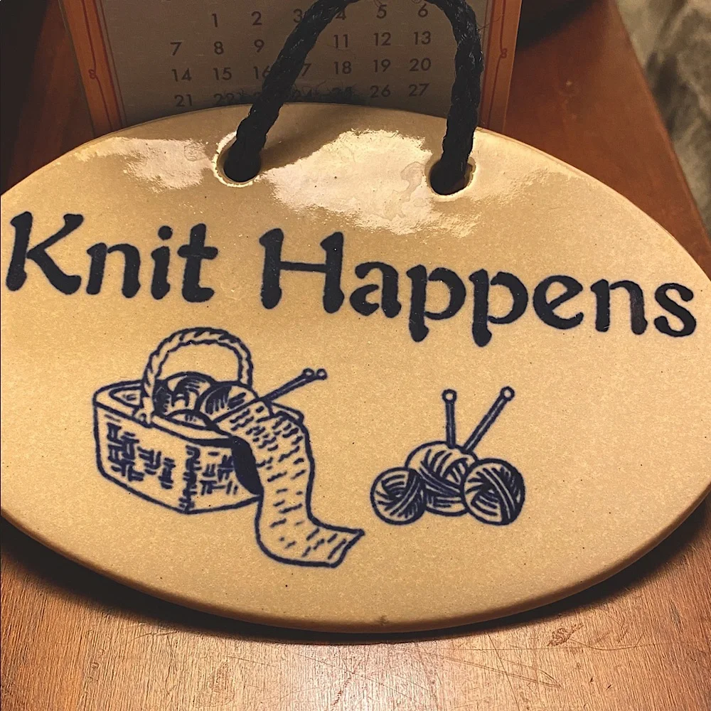 “Knit Happens” Hanging Plaque by Mountain Meadows Pottery. Features Yarn/Needles
